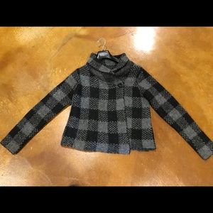 A short Susan Bristol cardigan sweater